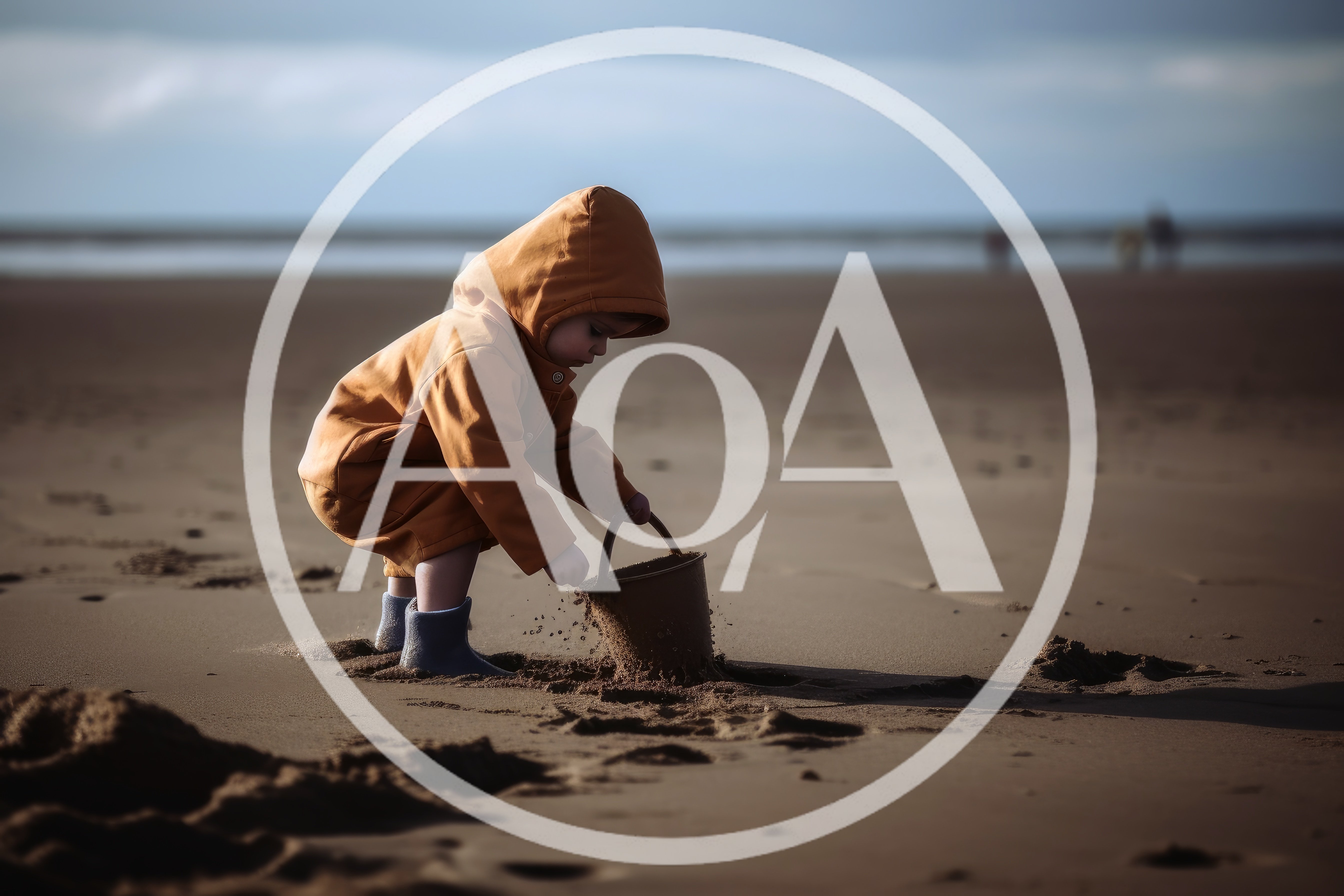 Toddler Playing With Sand Bucket On Beach