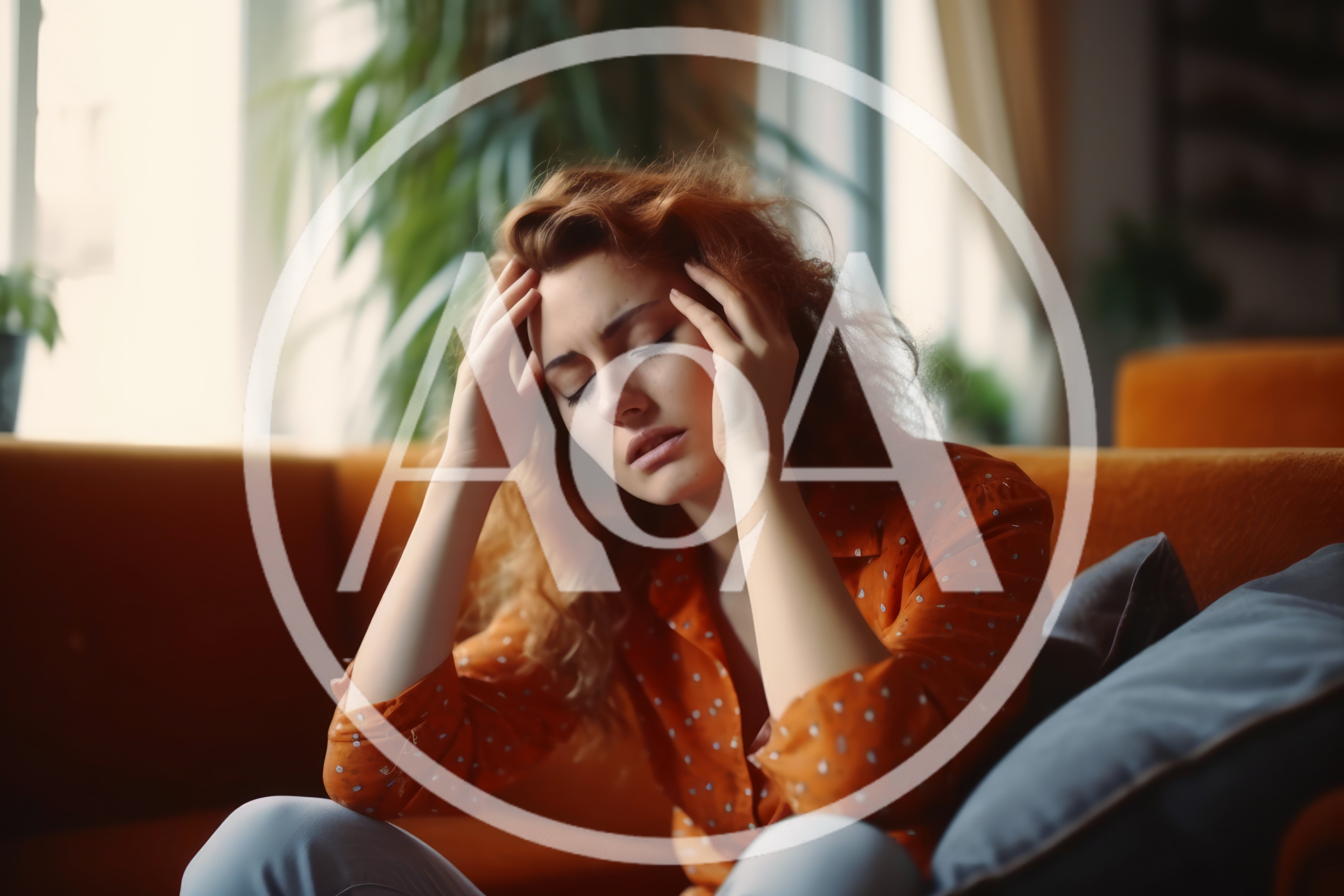 Stressed Woman Sitting On Sofa With Headache