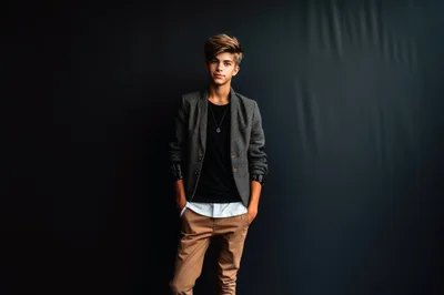 Stylish Teenage Boy Posing In A Patterned Blazer
