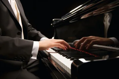 Pianist Playing Grand Piano In Formal Attire