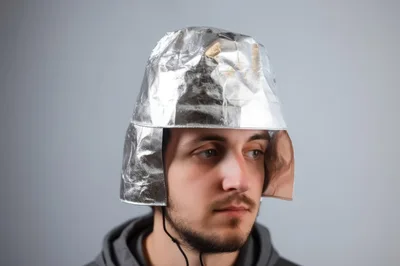 Young Man Wearing A Homemade Tin Foil Helmet