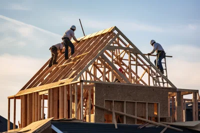 Construction Workers Framing Residential Roof Structure
