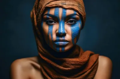 Portrait Of A Woman With Blue Face Paint