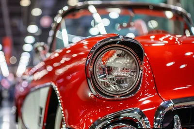 Close Up Of A Classic Red Vintage Car Headlight