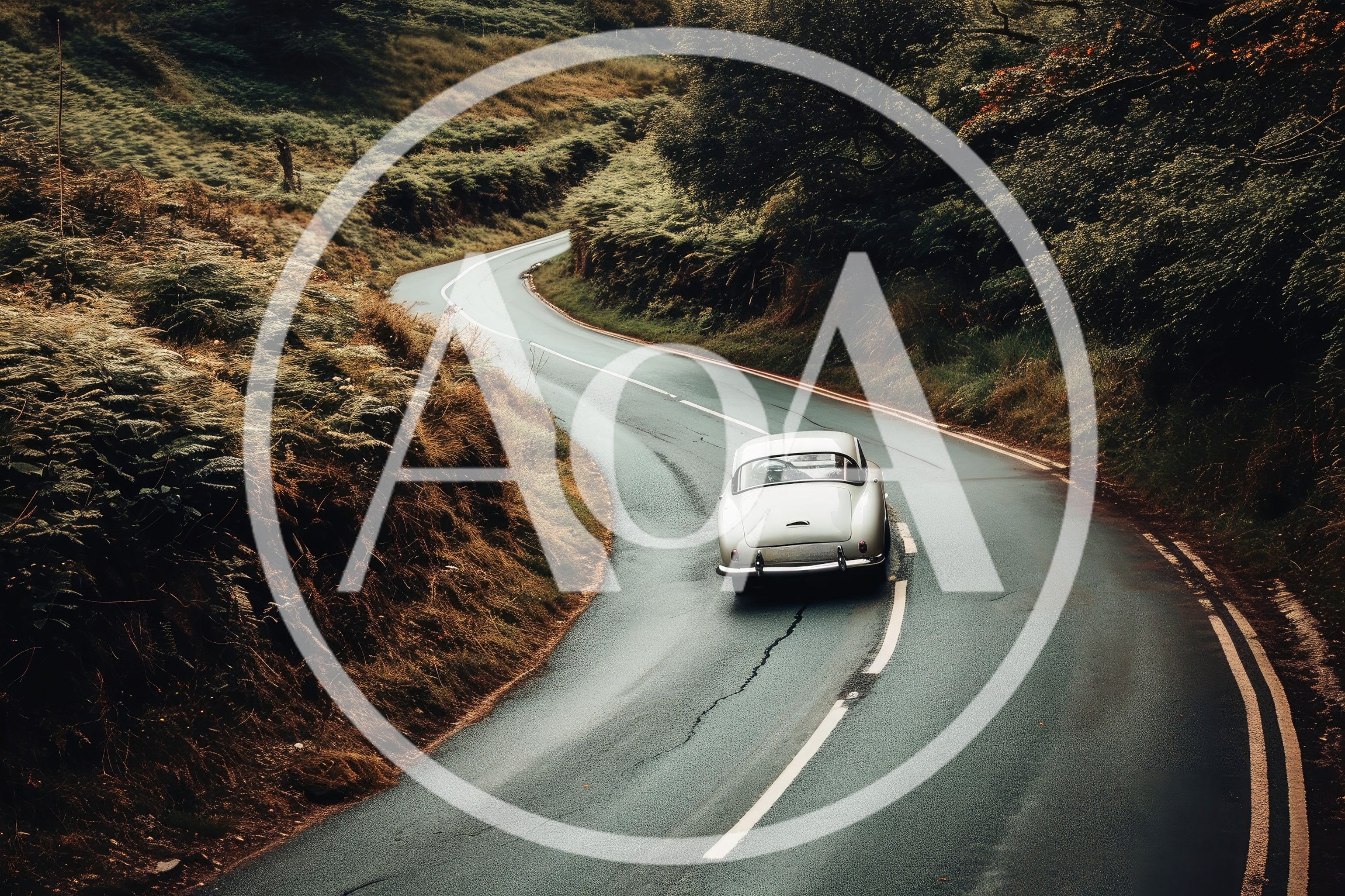 Vintage Sports Car Driving Along A Winding Country Road