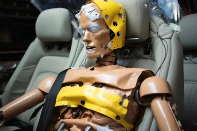 Crash Test Dummy Seated In Vehicle Interior