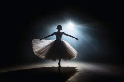Ballerina Performing Graceful Dance Under Dramatic Spotlight