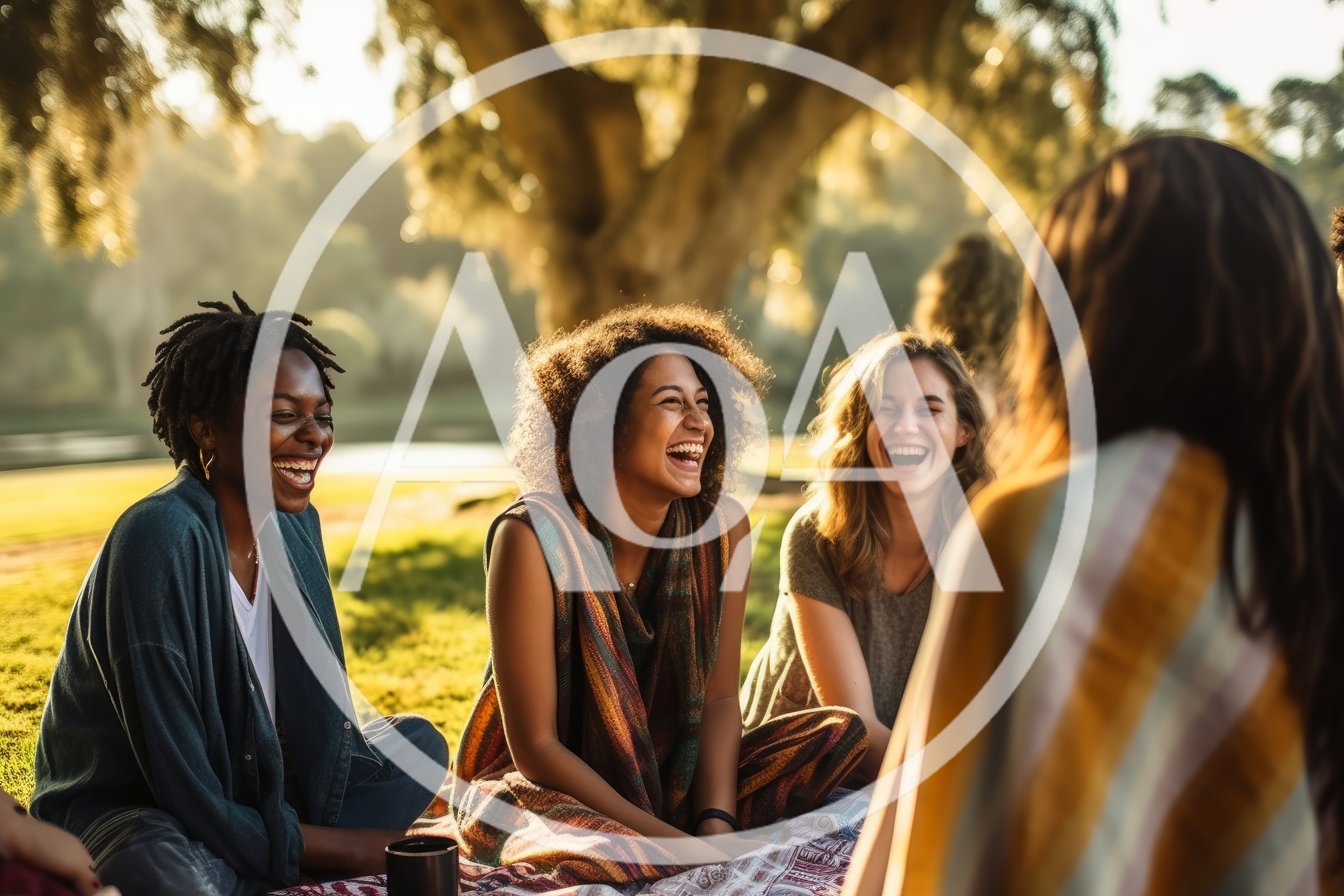 Diverse Friends Laughing Together During Outdoor Picnic