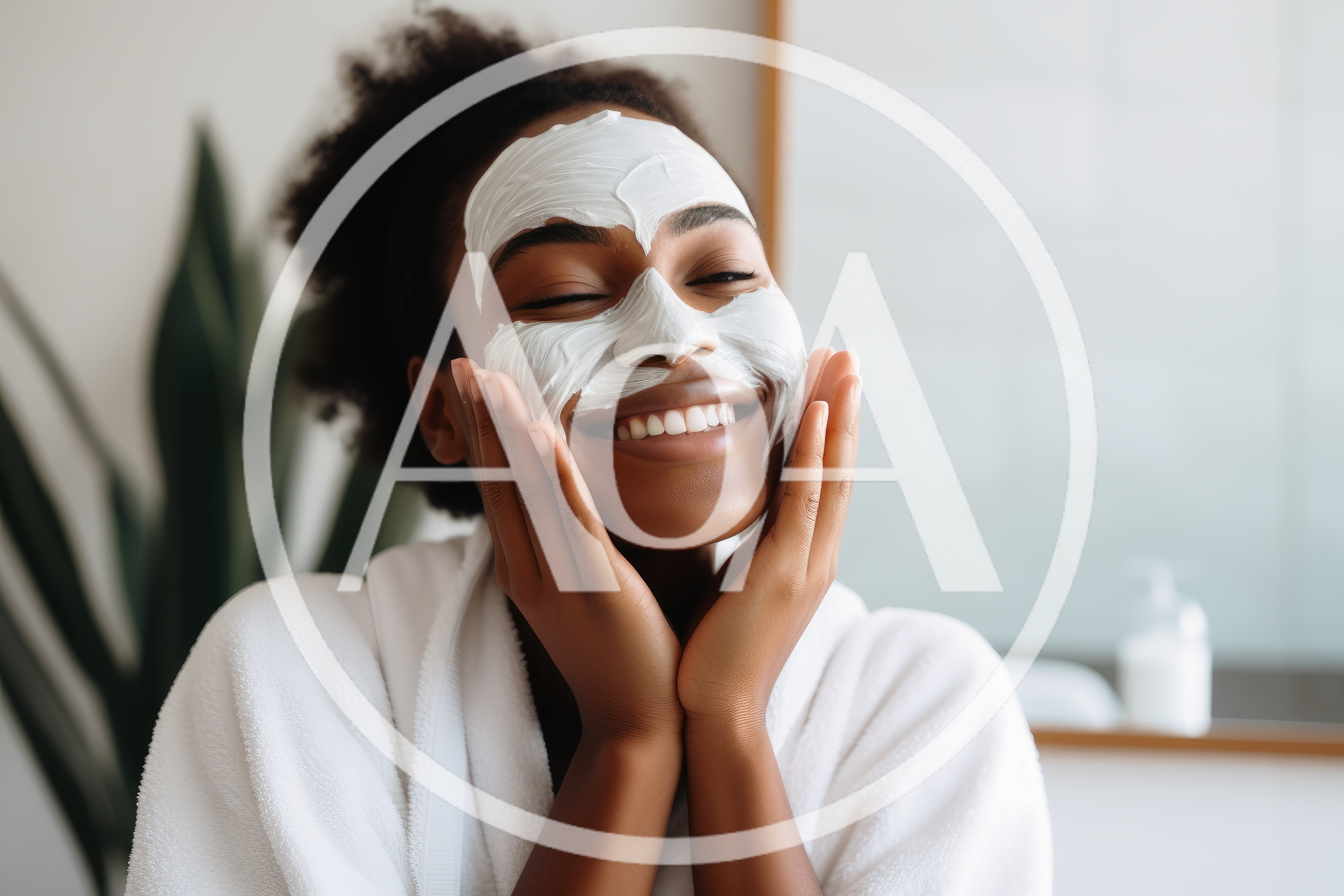 Young Woman Applying White Facial Mask In Bathroom
