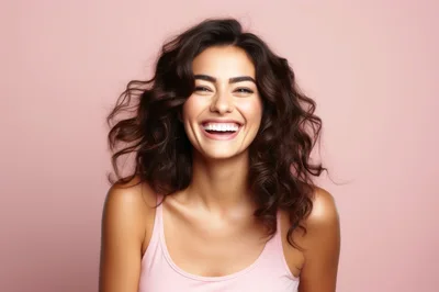 Portrait Of A Joyful Woman With Curly Hair