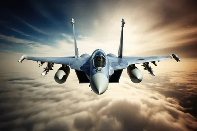 Fighter Jet Flying Above Clouds At Sunset