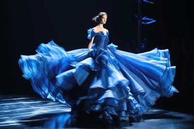 Fashion Model Walking In A Voluminous Blue Gown