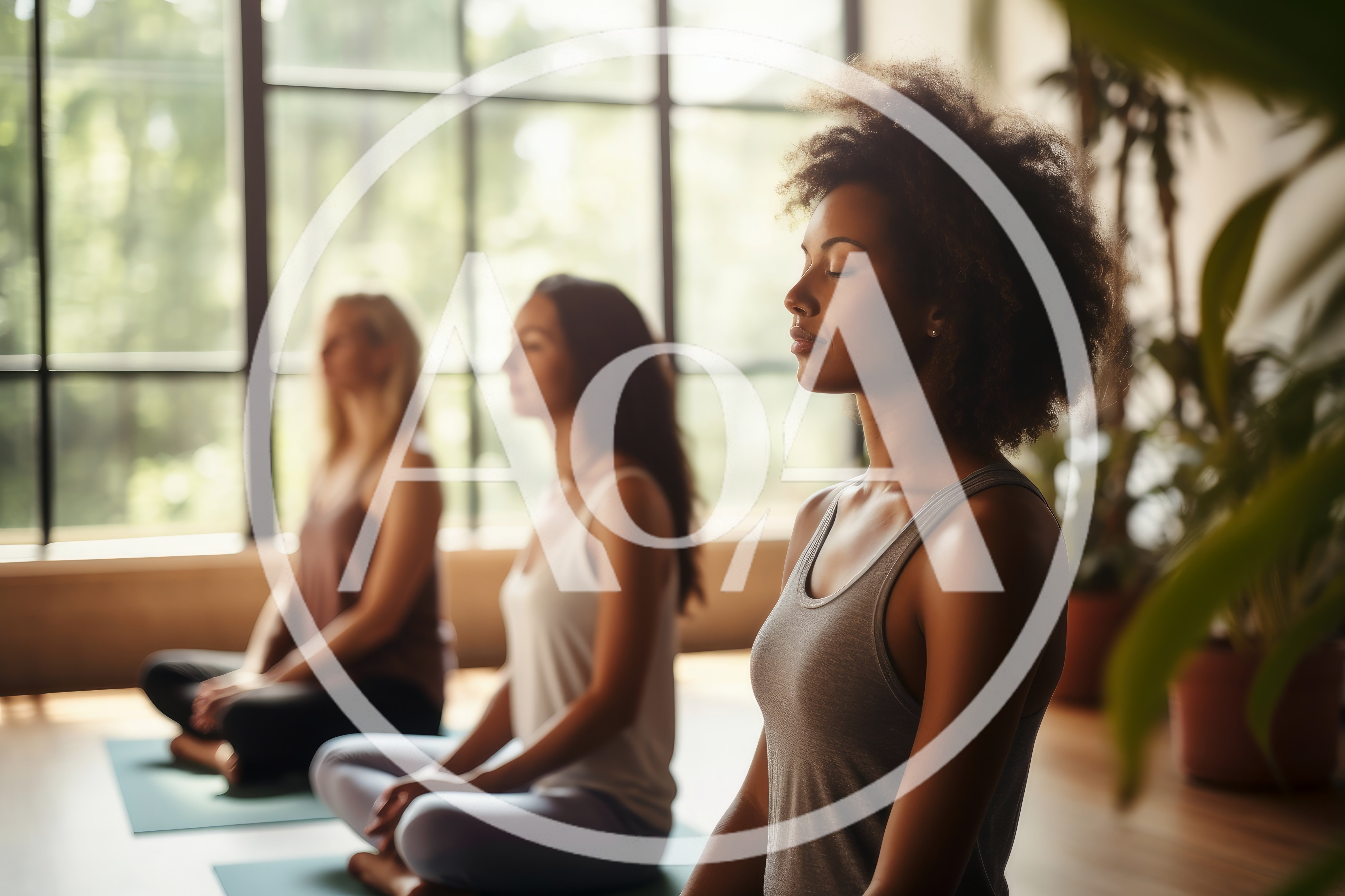Diverse Women Practicing Meditation In A Yoga Studio