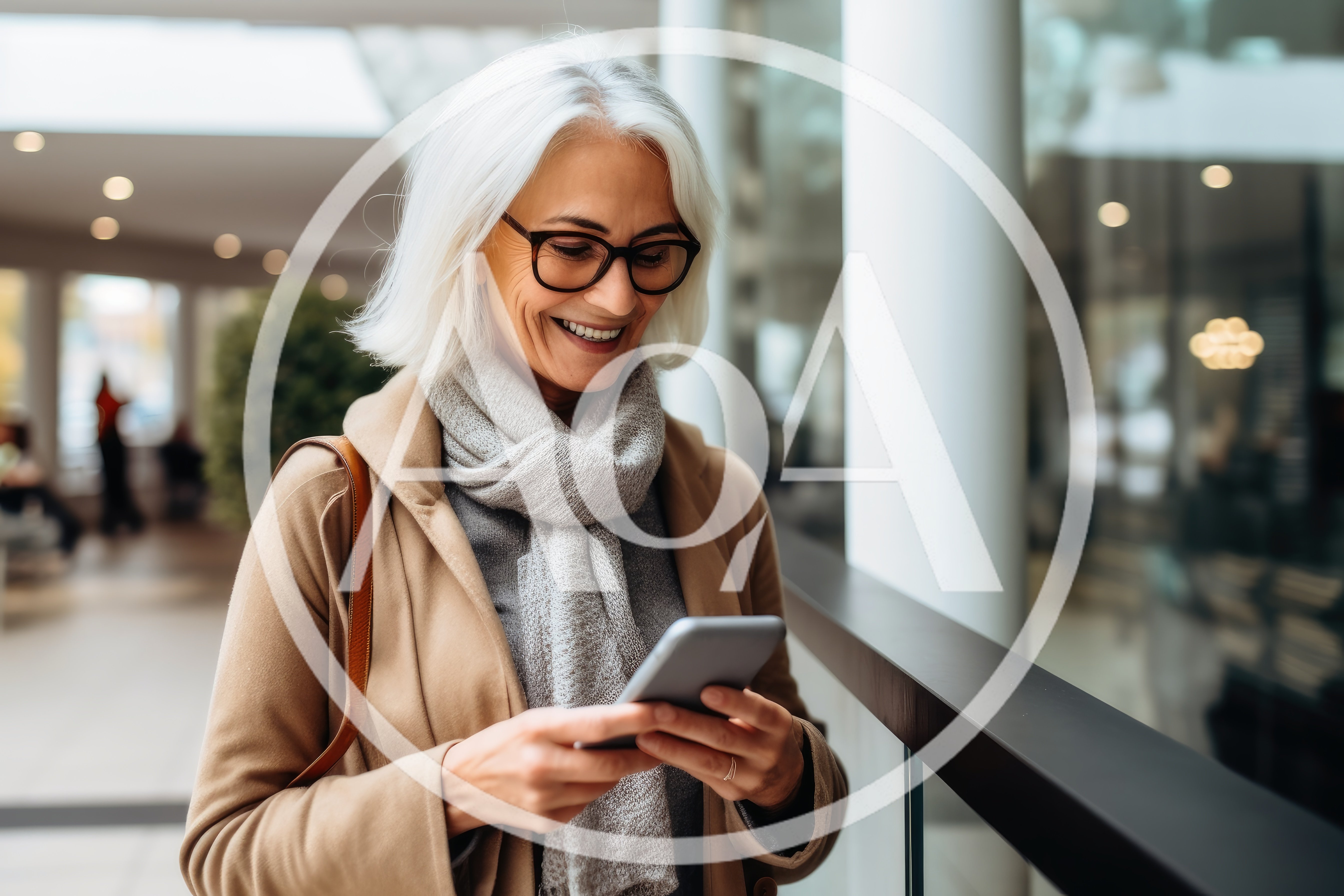Mature Woman Using Smartphone In Modern Shopping Mall