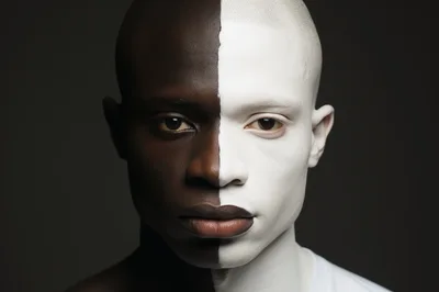 Portrait Of A Man With Split Black And White Face