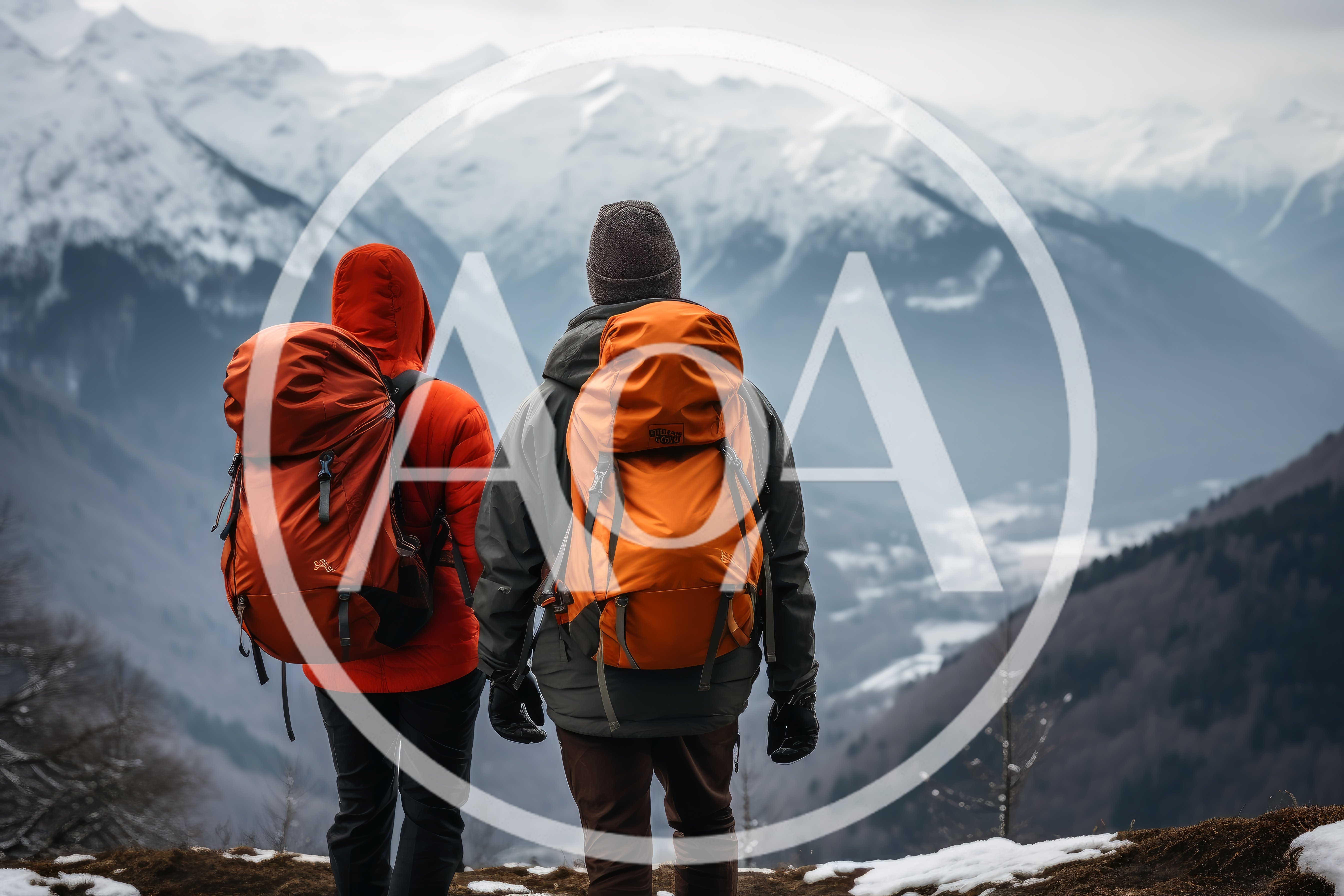 Two Hikers Standing On A Snowy Mountain Peak