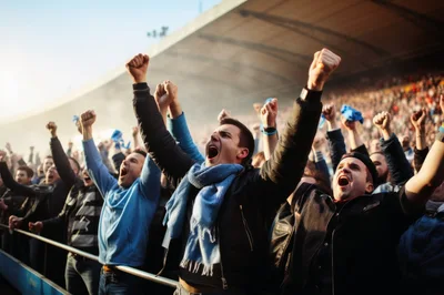 Passionate Soccer Fans Cheering In Stadium Crowd