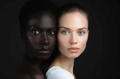 Portrait Of Two Women With Contrasting Skin Tones