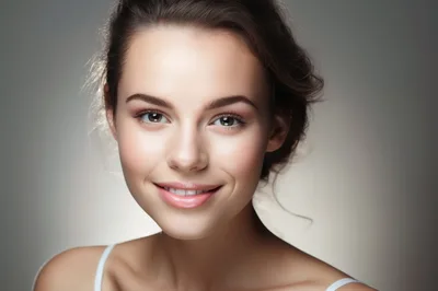 Portrait Of A Smiling Young Woman With Natural Makeup
