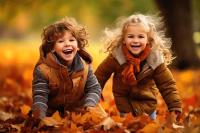 Happy Children Playing In Autumn Leaves