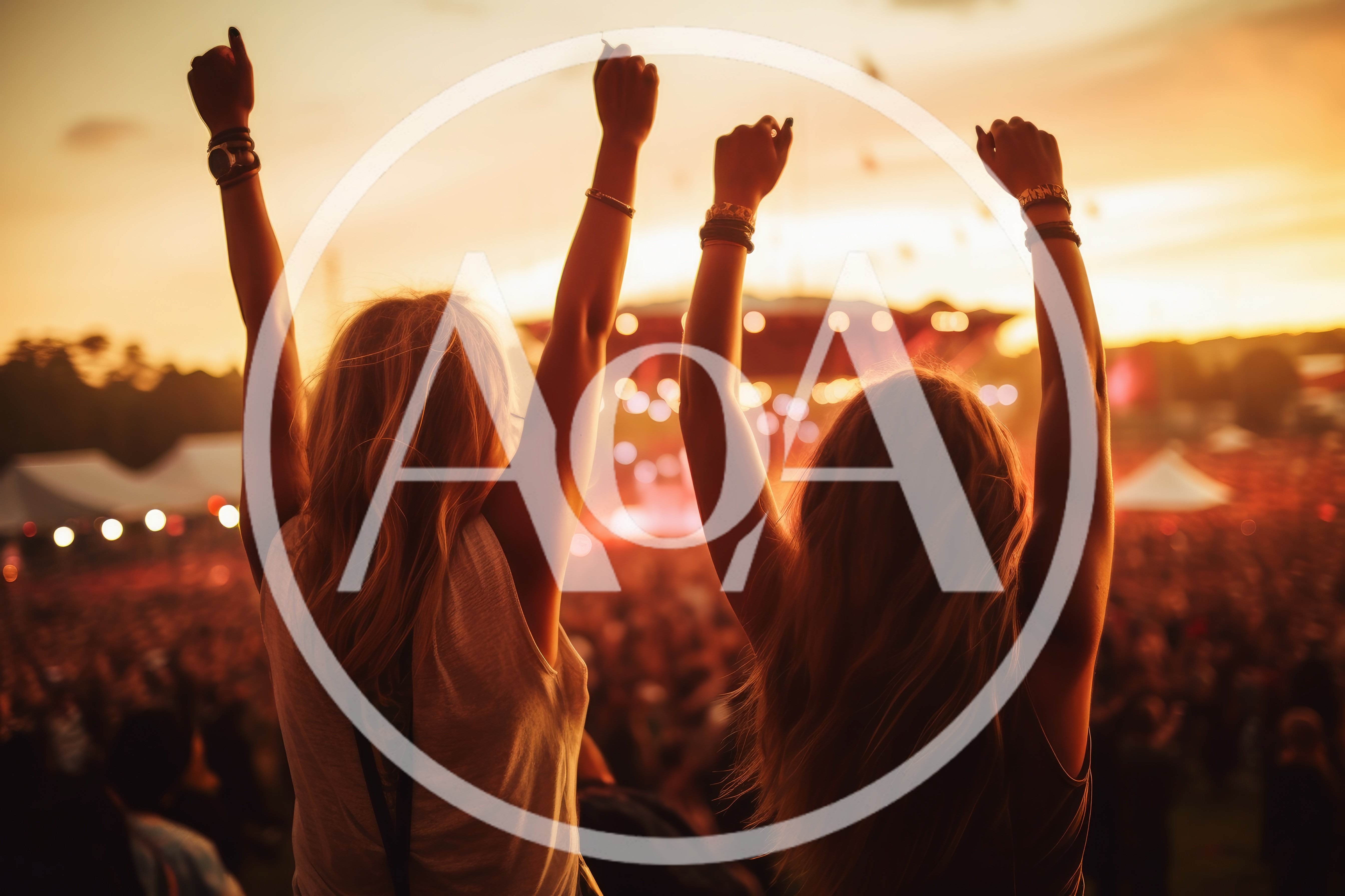 Two Women With Arms Raised At Music Festival