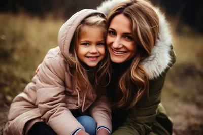 Mother and Daughter Smiling Together Outdoors