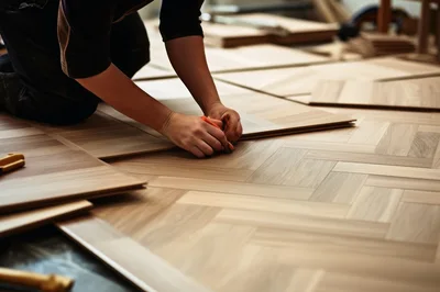 Professional Flooring Contractor Installing Herringbone Wood Planks