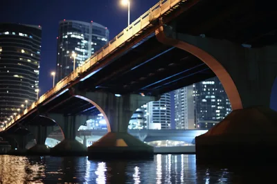Modern Concrete Bridge Over River At Night