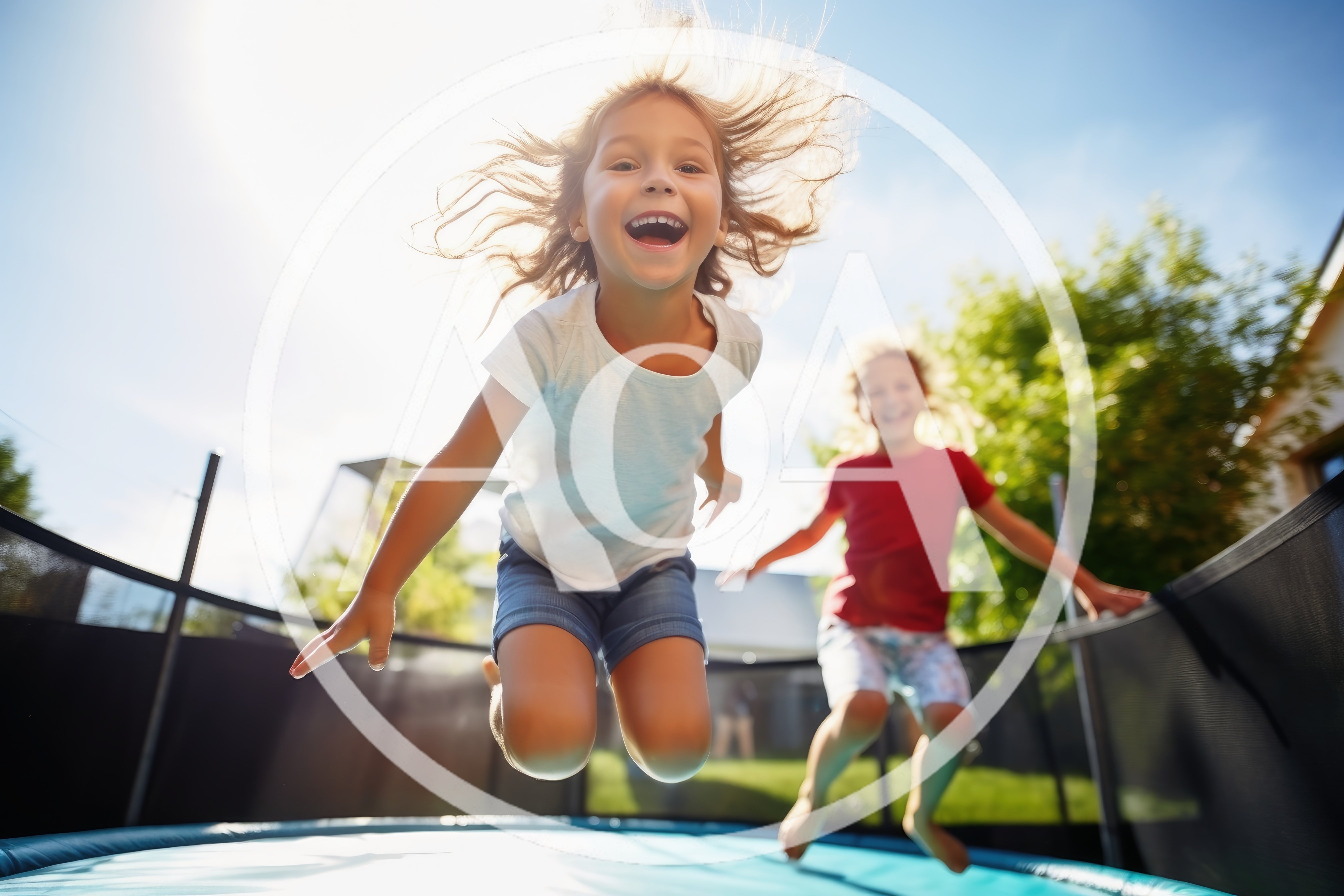 Happy Children Jumping Together On A Backyard Trampoline