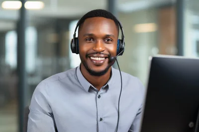 Smiling African American Customer Service Representative Wearing Headset