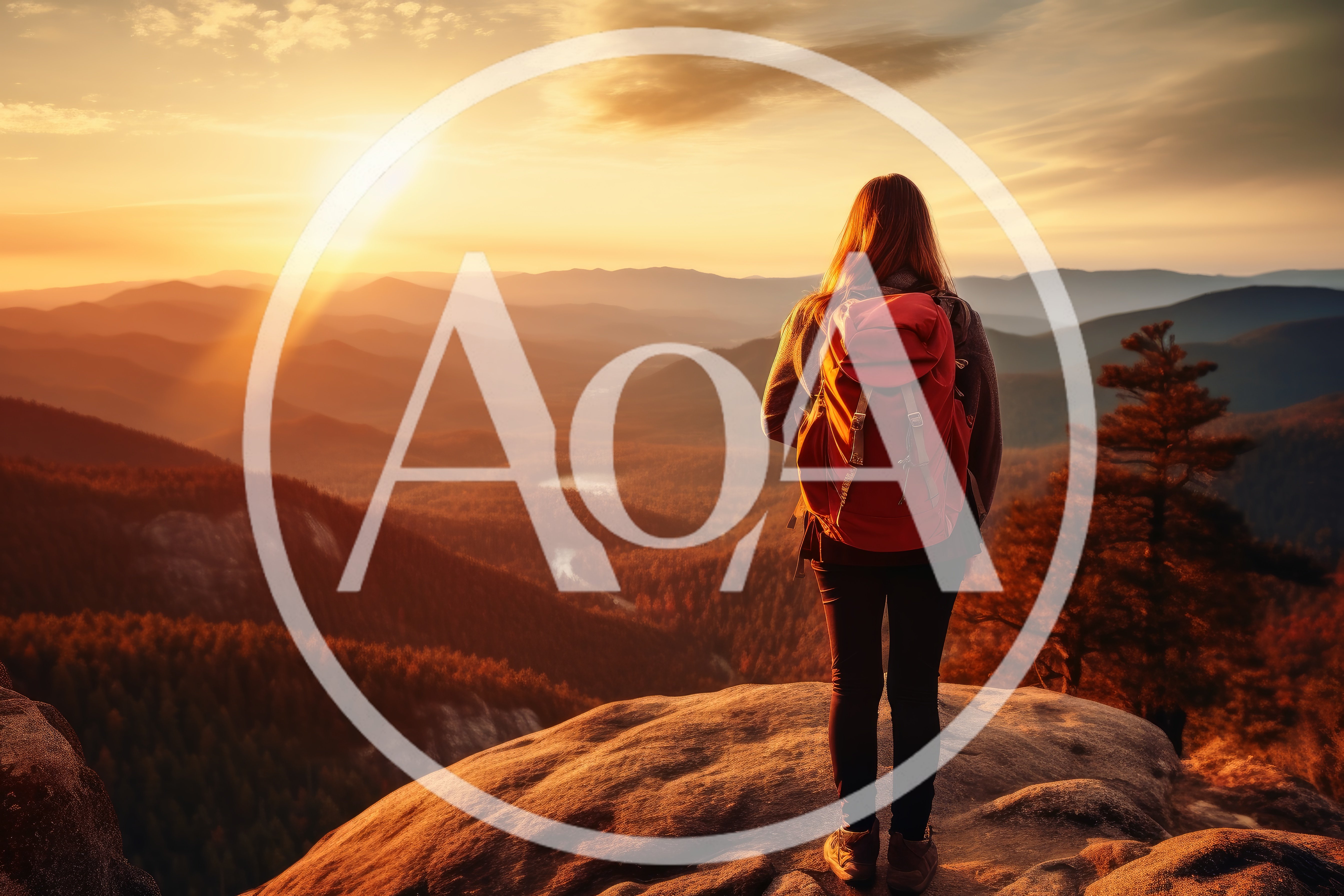 Hiker Standing On Mountain Peak At Sunset