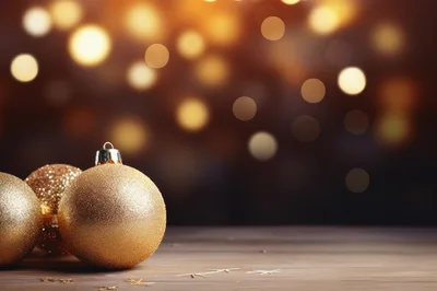 Golden Christmas Ornaments On A Wooden Surface