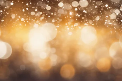 Abstract Golden Bokeh Background With Floating Light Particles