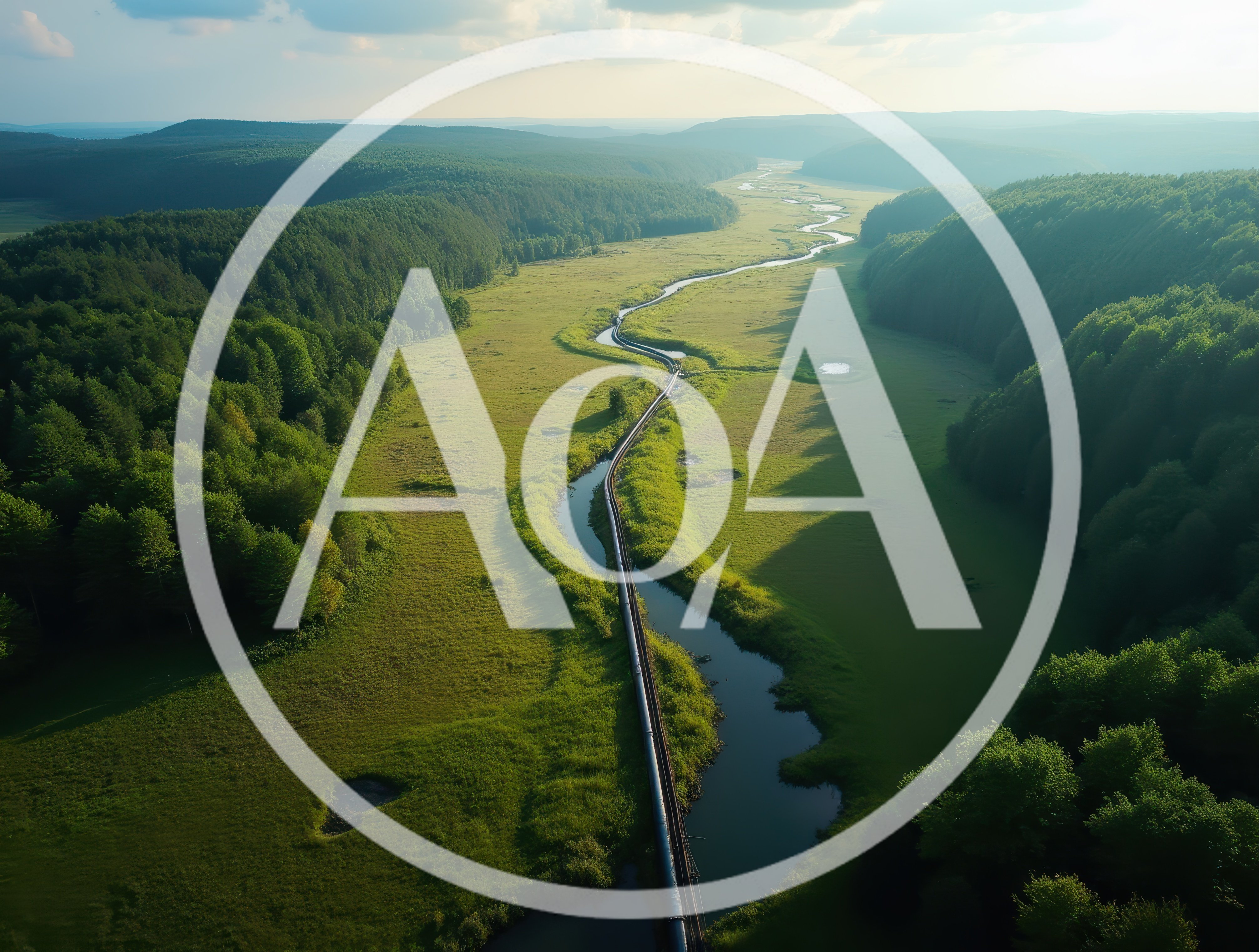 Aerial View Of A Train Traveling Through A Green Valley
