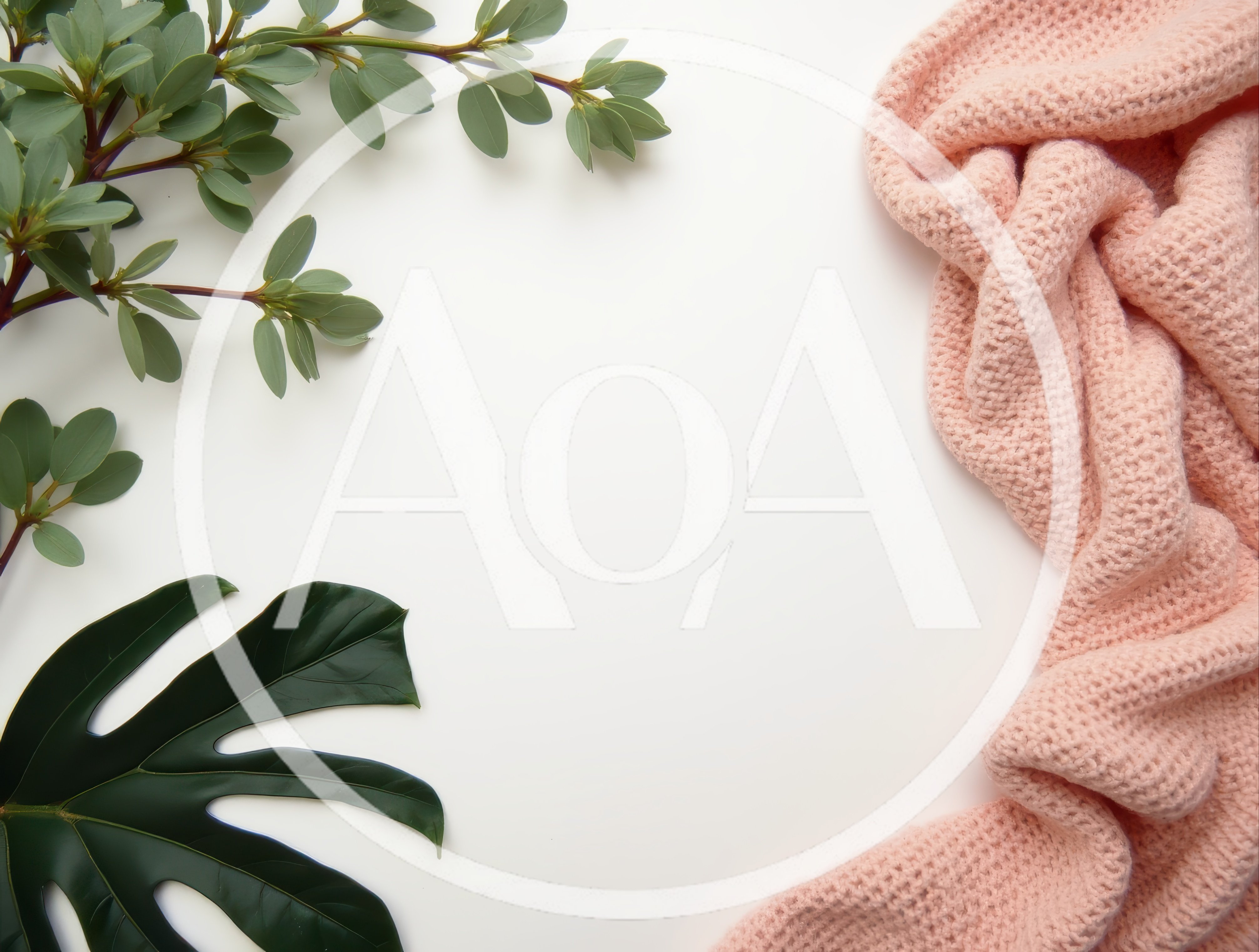 Flat Lay Composition With Pink Knit Fabric And Green Leaves