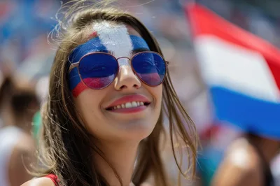 Young Woman With Dominican Republic Flag Face Paint