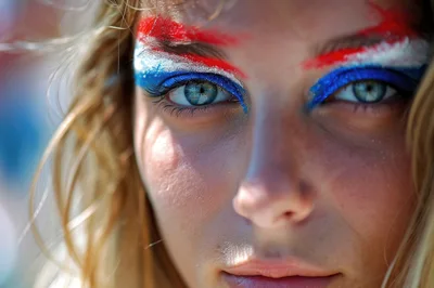 Close Up Portrait Of A Woman With Patriotic Face Paint