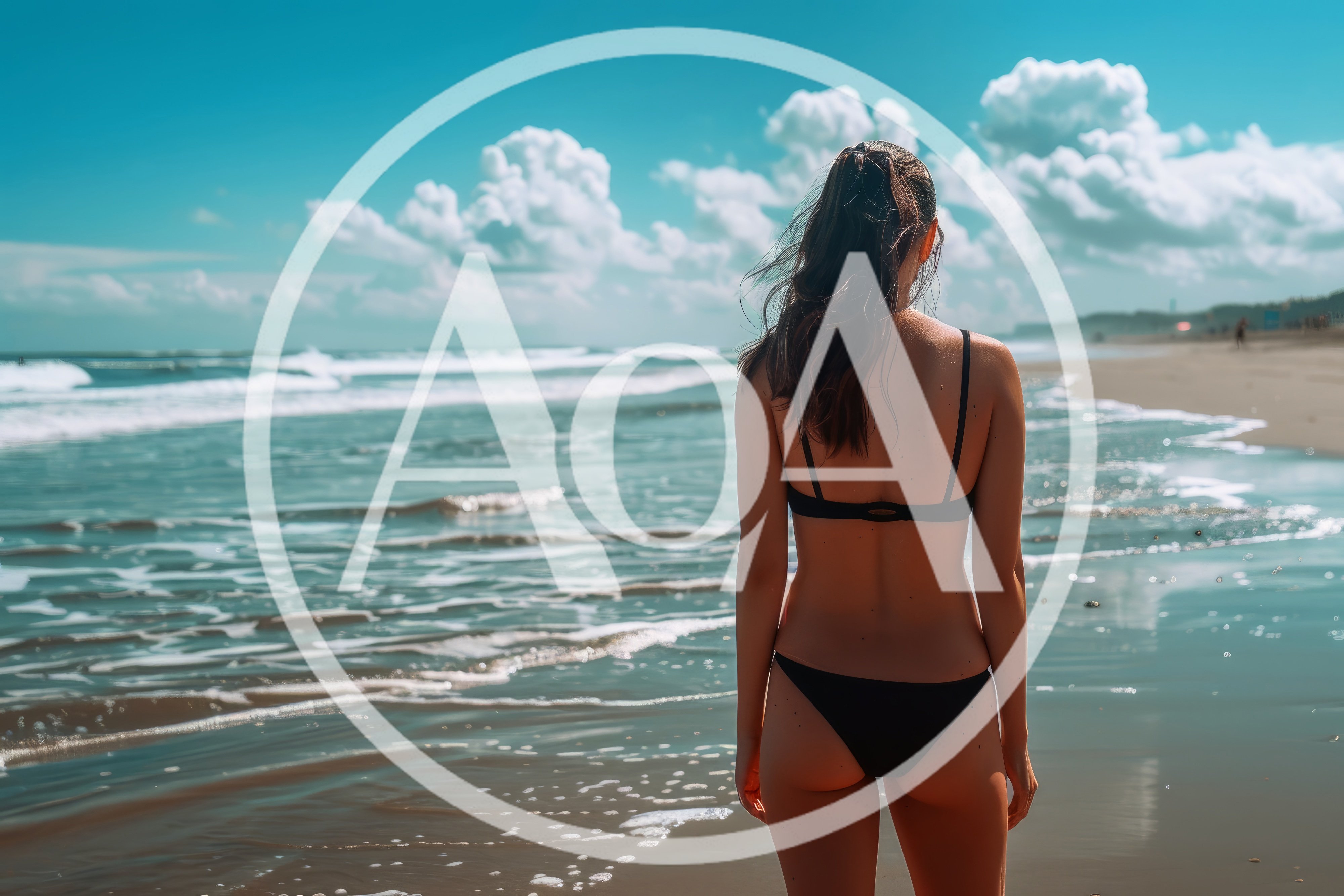 Young Woman Standing On Beach Looking At Ocean
