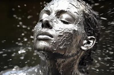 Woman Covered In Liquid Silver Under Water Spray