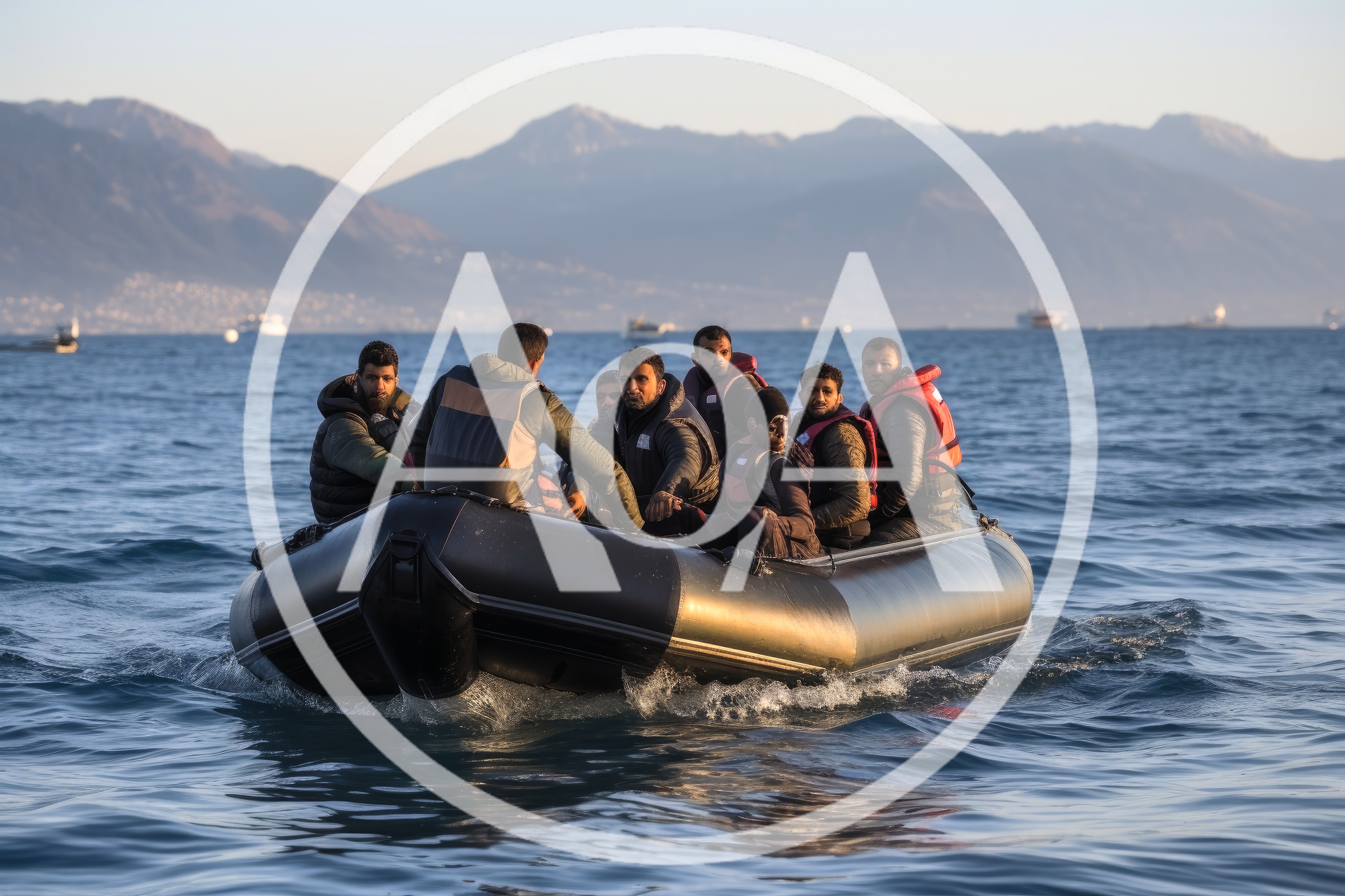 Group Of Migrants Traveling In An Inflatable Rubber Boat