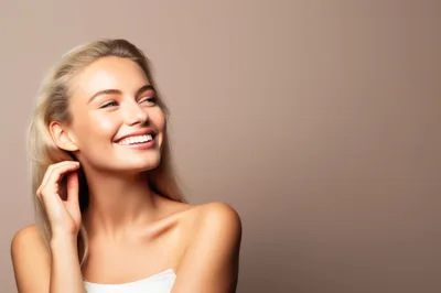 Portrait Of A Smiling Blonde Woman With Radiant Skin
