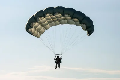 Military Paratrooper Descending With Tactical Canopy