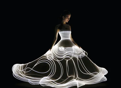 Woman Wearing A Glowing Fiber Optic Ball Gown