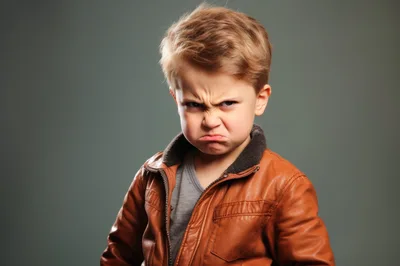 Angry Young Boy Wearing A Brown Leather Jacket