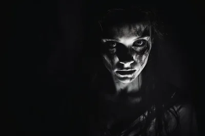 Eerie Portrait Of A Woman With Dark Makeup