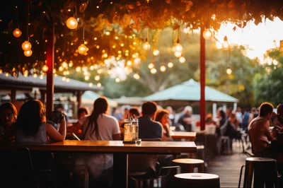 People Socializing At An Outdoor Evening Restaurant Patio