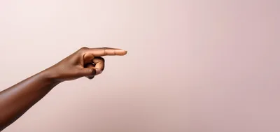Dark Skinned Hand Pointing To The Right