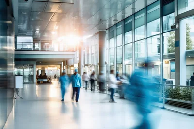 Medical Professionals Walking Through Modern Hospital Corridor