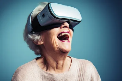 Senior Woman Laughing While Wearing Virtual Reality Headset