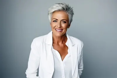 Professional Mature Woman Smiling In White Blazer